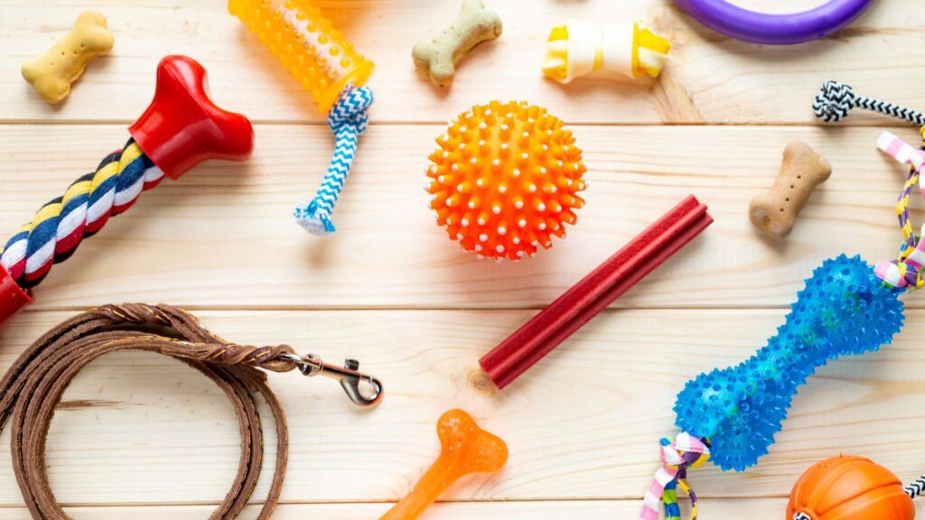 many dog toys, including rope toys, rubber balls, and more, that are good toys for heavy chewers